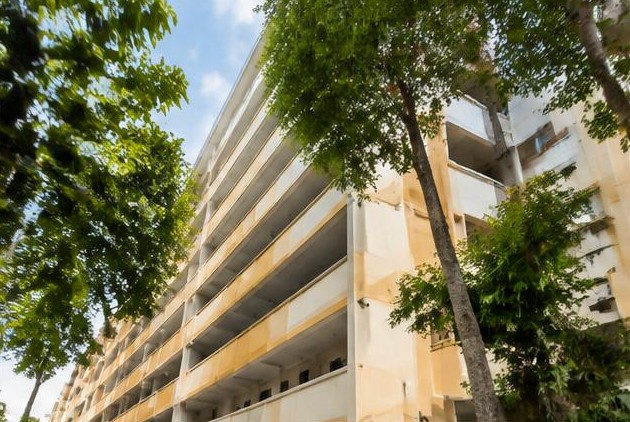 Representative HDB exterior for this prototype scenario